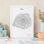 Framed map of Paris on a desk with stationery items