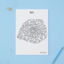 Map of Paris with neighborhood names on a white background, placed on a blue surface with a pencil and paper clips.